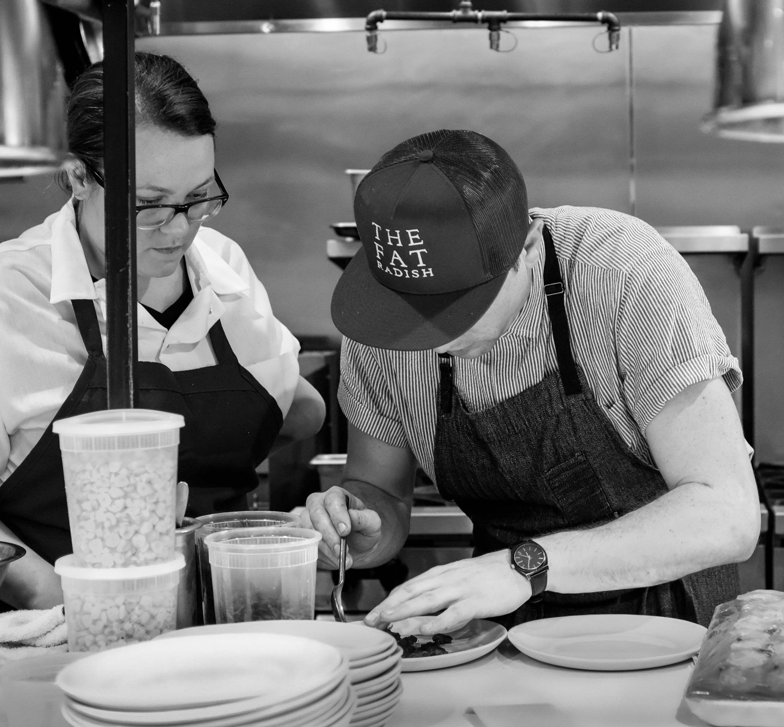 Chef Nick Wilbur Plating Food at Fat Radish pop-up at Basic Kitchen